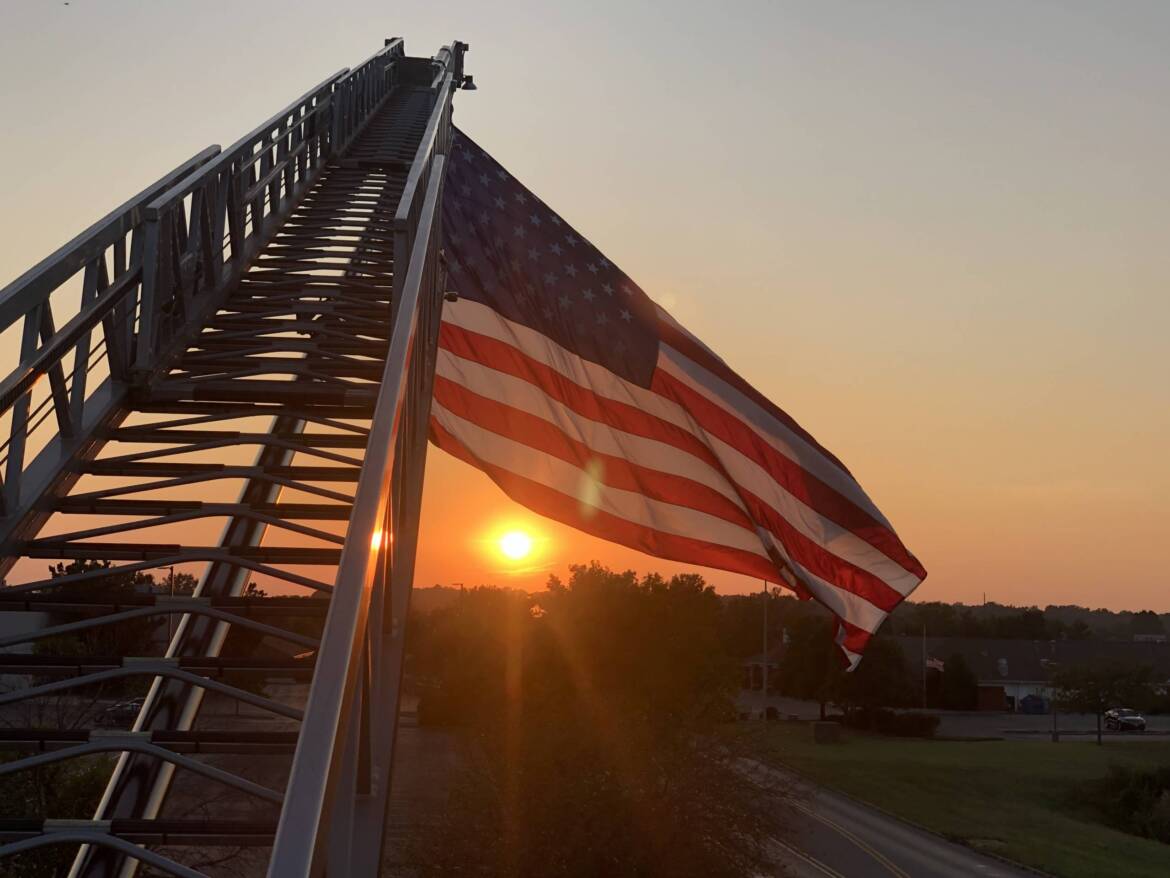 Flag-with-Sunset-scaled.jpg